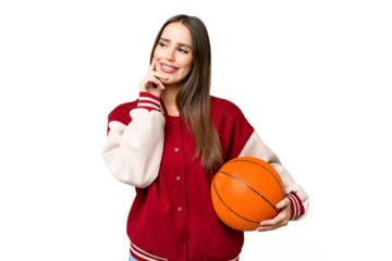 Young beautiful woman playing basketball over isolated chroma key background thinking an idea while looking up