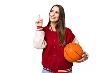 Young beautiful woman playing basketball over isolated chroma key background pointing up a great idea