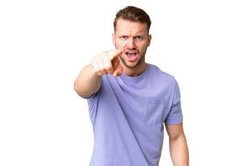 Young handsome caucasian man over isolated chroma key background frustrated and pointing to the...