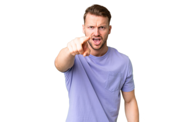 Young handsome caucasian man over isolated chroma key background frustrated and pointing to the front