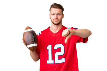 Young caucasian man playing rugby over isolated chroma key background showing thumb down with negative expression