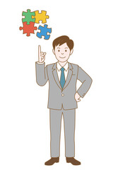 パズルのピースを指差すビジネスマン