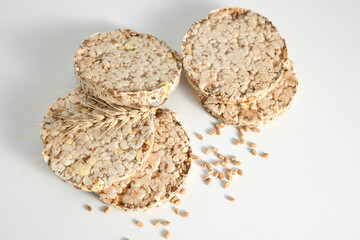 healthy diet light and crispy bread without yeast from whole grains on a white background, close-up