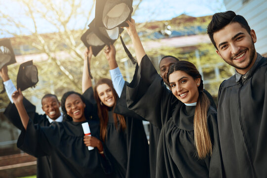 University, graduation and hats off or group of students together with joy or celebrating academic achievement and outdoors. Certification, victory and happy scholars outside or diversity and robes