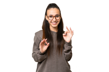 Young Arabian woman over isolated chroma key background showing ok sign with two hands