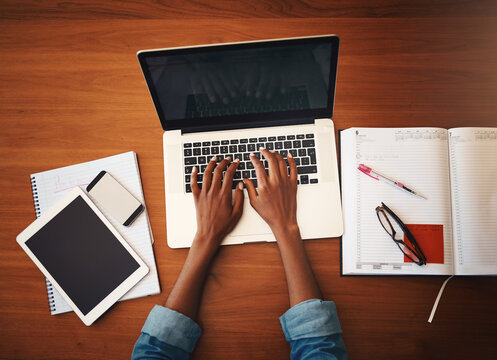 Woman hands, online typing and laptop with education and learning notes at home. Top, female person and computer working with studying, student notebook and writing in a house doing web research