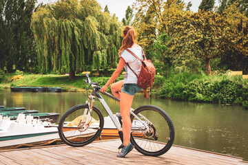 Woman tourist in bicycle in Marais Poitevin- Marshland in France- Poitou Charente