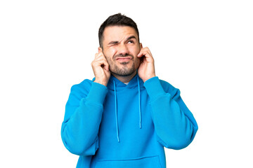 Young handsome caucasian man over isolated chroma key background frustrated and covering ears