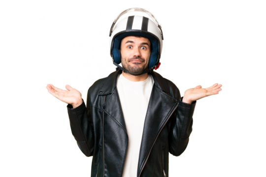 Young caucasian man with a motorcycle helmet over isolated chroma key background having doubts while raising hands