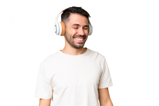 Young caucasian man over isolated chroma key background listening music