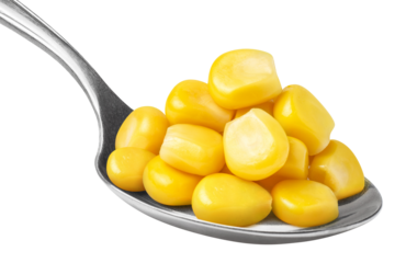 Delicious corn seeds in metal spoon, cut out