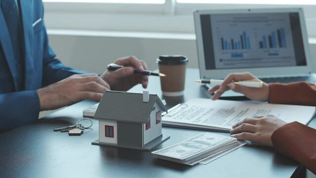 Real estate agent and realtor general liability insurance businessman professional consultant with house toy model