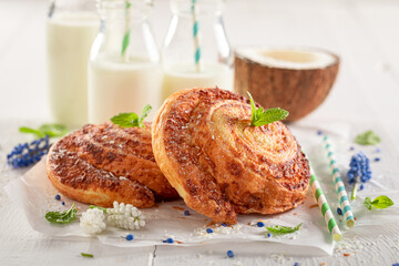 Traditionally coconut rolls with powdered sugar. Scandinavian dessert.