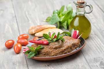 Traditional Lebanese Raw meat kibbeh with olives oil and pita bread and veggies, traditional Lebanese food of Kibbeh 