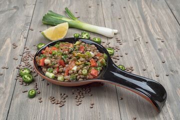 Lentil salad with veggies, healthy food, vegetarian and vegan snack, clean eating, diet, detox. Vegetables and cooking background