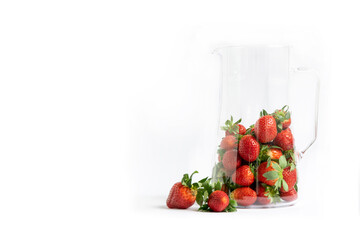 Fresh strawberries on a white background in a jug with highlights. Berry composition with space for text.