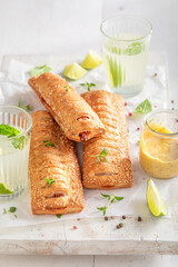 Unhealthy and tasty hot dogs with ketchup and mustard.