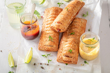 Fresh and delicious hot dogs with sausage and puff pastry.