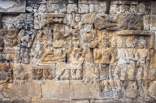 Reliefs on the walls of the Borobudur temple in Magelang, Central Java, Indonesia. there are about 1,400 relief panels, the reliefs depict the story of the Buddha and his teachings.