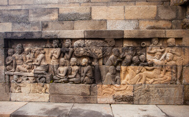 Reliefs on the walls of the Borobudur temple in Magelang, Central Java, Indonesia. there are about 1,400 relief panels, the reliefs depict the story of the Buddha and his teachings.