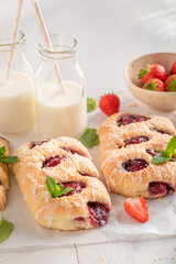 Yummy strawberry yeast cake with glaze and crumble.