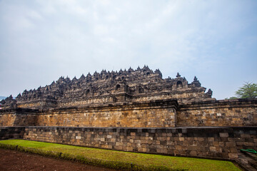 Fototapeta premium Borobudur Temple, a Buddhist temple located in Magelang, DI Yogyakarta, Indonesia. It is the largest Buddhist temple in the world decorated with many stupas and Buddha statues.