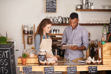 Tablet, restaurant and owner in teamwork of people, discussion and manage orders in store. Waiters, black man and happy woman in cafe with technology for inventory, stock check and managing sales.