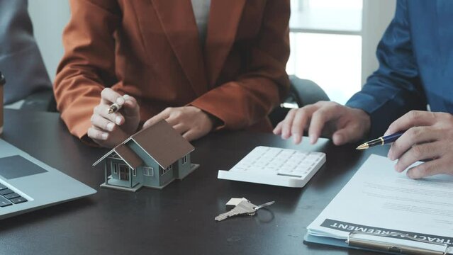 Real estate agent and realtor general liability insurance businessman professional consultant with house toy model