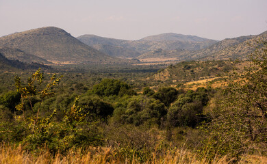 View of landscape in Pilanesberg National Park looking over a valley