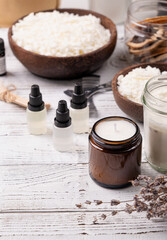 Set for crafting candle on wooden background. Eco soy wax and candle making tools top view, flat lay