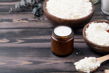 Set for crafting candle on wooden background. Eco soy wax and candle making tools top view, flat lay