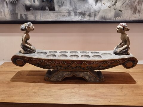 Congklak or Mancala is a traditional Indonesian folk game tool made of wood