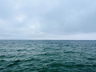 Cloudy gray seascape, sea coast, windy cloudy weather 
