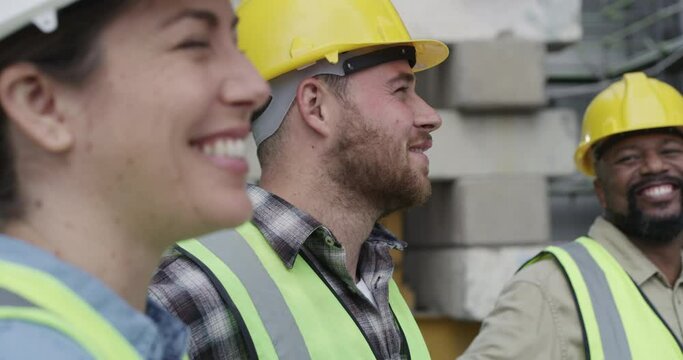 Collaboration, construction and an engineering team laughing together while working on a project. Meeting, building or planning with an engineer, architect and technician talking while happy on site