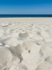 Fototapeta na wymiar White sand at the beach, natural white sea sand background
