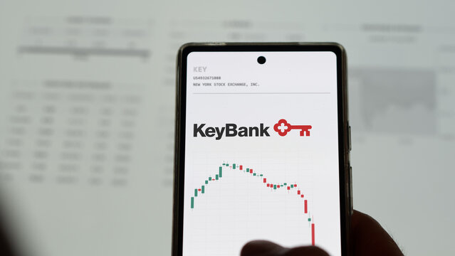 March 20th 2023. An investor of regional bank analyzing the KeyBank shares price on a phone screen.
