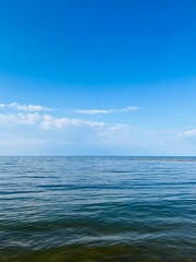 Transparent sea water, blue sea horizon, blue sky 