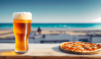 glass beer and pizza on the beach