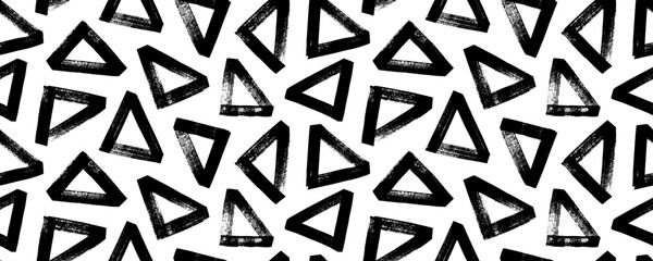 Geometric seamless pattern with bold triangles. Geometric abstract texture, horizontal vector banner. Brush drawn grunge triangles with rough edges and dry texture. Trendy contemporary design.