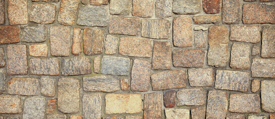 The rugged beauty of the stone wall texture reveals strength and history. A symbol of resilience, authenticity, and the passage of time etched in every crevice