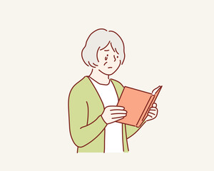  Old woman crying reading a book. Hand drawn style vector design illustrations.