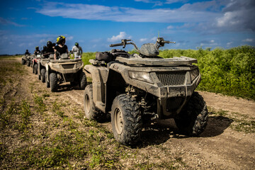 Fototapeta premium Quad bike in a field, atv motorcycle, sunny day