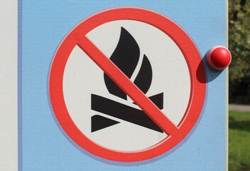 No camp fire sign. Sign which shows its prohibited to make a fire here. Bush fire season - no open flame out doors. No fire on the beach. Light cold colors - clear sign. High resolution image - Powered by Adobe