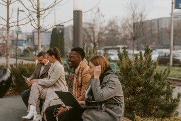Four business people at the park