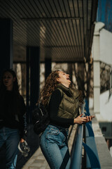Beautiful girl saw something funny on her phone. She burst out laughing