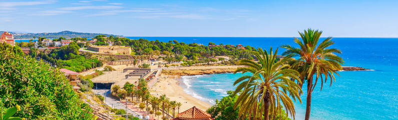 Beach in Tarragona city, Spain, South Europe. Sea coast in Catalonia - obrazy, fototapety, plakaty
