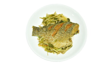deep fried Nile Tilapia or mango fish slice dressing soy sauce and spring onion on plate 