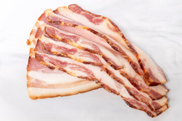 Smoked bacon sliced on marble board.