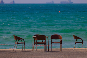 plastic chairs on the beach