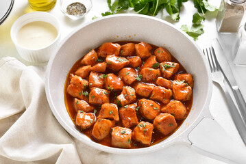 Sweet and spicy chicken bites with sauce